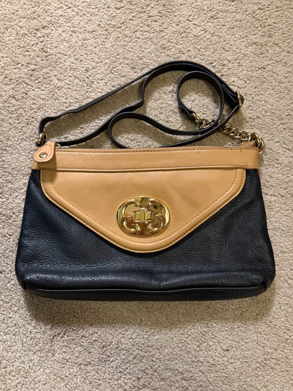 Emma Fox Black Tan Leather crossbody bag with a gold turn-lock closure